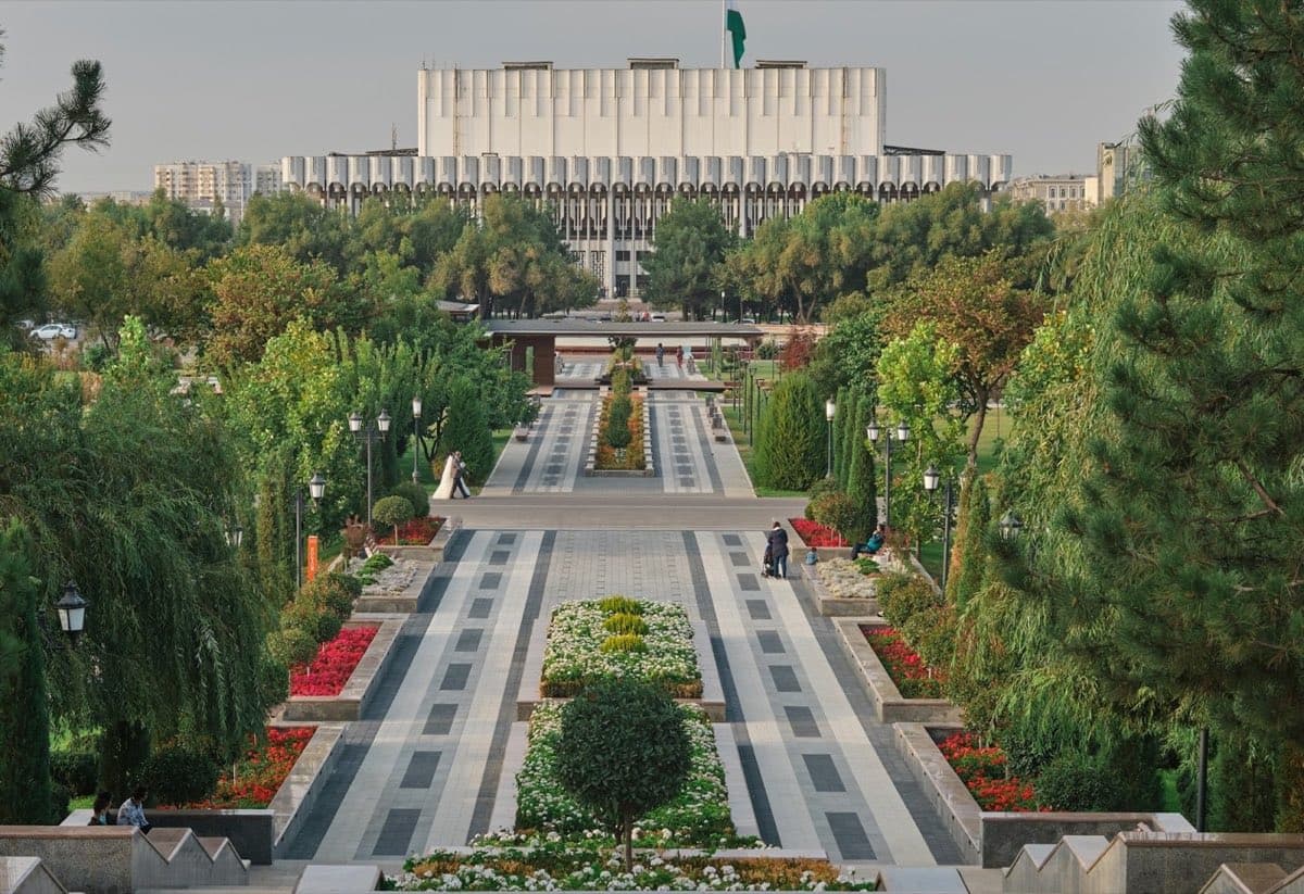 A park in Tashkent with the Uzbek flag in the distance